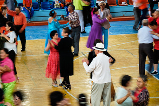 Senior citizens participate in a dance competition at a community center in Mongolia.