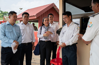 (From left) Mr Bunyoeui Siea, RRT & Deputy Chief of Finance at Battambang Provincial Health Department, Khiev Patt, health officer at Sampov Loun Referral Hospital, Ms Kimthy Nhim, health environment manager of prevention and disease control at Battambang Provincial Health Department, Vorn Longdinaer, health officer at Sampov Loun, and Chau Arun, health officer at the border checkpoint, discusses the current COVID-19 issues at the Phnom Dey International border checkpoint. In 2021, with funding from the European Union, the World Health Organization partnered with the Ministry of Health to conduct COVID-19 health check and emergency response at Cambodia's borders.   Watch https://youtu.be/-2VftCHB36A
