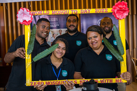 (From left) Rise Beyond the Reef team members Maika Nativa, Daiana Bola, Jonati Bale, Mere Sawailau, and Revoni Vamosi at the photo booth during the World Mosquito Day event. Disclaimer: This image was captured during the global response to the COVID-19 pandemic. While the contents of this image might not be directly related to COVID, processes reflect the guidance communicated by local public health authorities at the time of its capture. Please note, public health guidance differs among countries and is indicative of the local context.