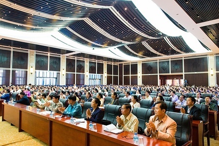 The audience of the National Launch of the Measles–Rubella Supplemental Immunization Campaign 2014 includes mothers, children, and representatives from various Lao PDR and international organisations.