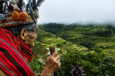 A local viewing the rice fields in Ifugao, Mountain Province