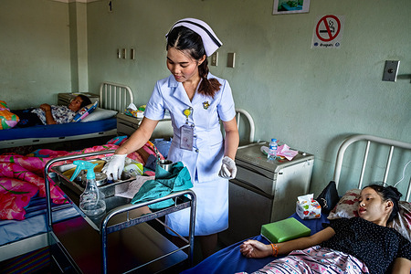 A health worker at work in Setthathirath Hospital in Vientiane.