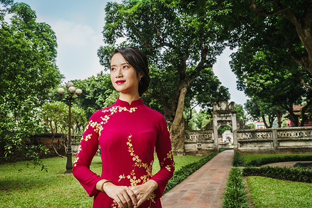 Portrait of a woman wearing a traditional dress in Hanoi