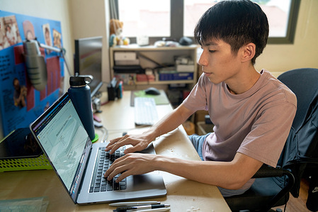 Timothy Liau works on his computer at his home. He proclaims that this study area helps him to be inspired on working and creating mental awareness programmes for schools and public. The  People of the Western Pacific   (POWP) project aims to bring a human perspective to the main public health priorities that have emerged for Member States across the Region. Through interviews and photo essays, these stories provide a snapshot of the subjects’ lives, concerns, dreams and expectations for the future.   https://www.who.int/westernpacific/people/tim-singapore the feature story from the https://www.who.int/westernpacific/people Watch https://www.youtube.com/watch?time_continue=77&v=ZP9ml-zK470&embeds_euri=https%3A%2F%2Fwww.who.int%2Fwesternpacific%2Fpeople%2Ftim-singapore&feature=emb_logo Disclaimer: This image was captured during the global response to the COVID-19 pandemic. While the contents of this image might not be directly related to COVID, processes reflect the guidance communicated by local public health authorities at the time of its capture. Please note, public health guidance differs among countries and is indicative of the local context.