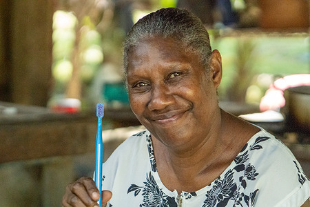 Emily, a preschool teacher at Aim Yee Kindy School,  promotes how to properly brush teeth with fluoride toothpaste to help develop life-long healthy habits. Aim Yee Kindy School is one of more than 30 preschools and schools in Vanuatu that have implemented the “Gudfala Tut Skul” or “Healthy Tooth School” programme aimed at reducing the high burden of tooth decay and dental caries in children throughout the country.  The  People of the Western Pacific   (POWP) project aims to bring a human perspective to the main public health priorities that have emerged for Member States across the Region. Through interviews and photo essays, these stories provide a snapshot of the subjects’ lives, concerns, dreams and expectations for the future.   https://www.who.int/westernpacific/people/emily-vanuatu the feature story from the https://www.who.int/westernpacific/people Watch https://www.youtube.com/watch?v=XXCqLO1jvQA&t=1s Disclaimer: This image was captured during the global response to the COVID-19 pandemic. While the contents of this image might not be directly related to COVID, processes reflect the guidance communicated by local public health authorities at the time of its capture. Please note, public health guidance differs among countries and is indicative of the local context.