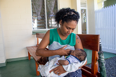 31-year-old Melaia breastfeeds her 10-week baby boy Temesia while waiting at Galoa Nursing Station. Melaia has decided to start mix feeding her baby as she returns to work at a nearby resort along Pacific Harbour.