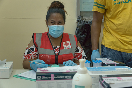 Red Cross volunteers conducts swab tests Across Tuvalu, WHO has worked with the Ministry of Health, donors, and partner organizations such as the Red Cross to continue to address the impact of the COVID-19 pandemic through community outreach, vaccination campaigns, emergency preparedness planning, and strengthening labs.  Disclaimer: This image was captured during the global response to the COVID-19 pandemic. The contents of this image reflect the guidance communicated by local public health authorities at the time of its capture. Please note, public health guidance differs among countries and is indicative of the local context.