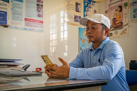Visal So checks messages on the Telegram group he set up to help with leprosy prevention program at Pram Yam Health Center. Visal is a social mobilizer, physical therapist, and program officer of National Leprosy Elimination Program (NLEP). In his role, he supports case detection, rehabilitation, and uses a compassionate people-centered approach that builds relationships with people affected by leprosy throughout Cambodia. Visal’s experience exemplifies how passion and care as a health worker can support patients who experience multidimensional stigma and discrimination. In Cambodia, WHO supports the Ministry of Health’s NLEP with the implementation of activities aimed at addressing stigma and discrimination experienced by people affected by leprosy.    Read more: https://www.who.int/westernpacific/news-room/feature-stories/item/caring-for-communities--a-tailored-approach-to-leprosy-elimination-in-cambodia Watch https://www.youtube.com/watch?v=DesgSkXbDcw&t=10s