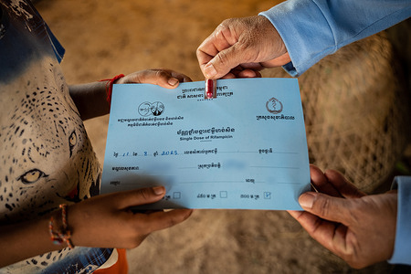 A healthcare worker hands a single dose of rifampicin. In Cambodia, WHO supports the Ministry of Health’s National Leprosy Elimination Program (NLEP) with the implementation of activities aimed at addressing stigma and discrimination experienced by people affected by leprosy.   Read more: https://www.who.int/westernpacific/news-room/feature-stories/item/caring-for-communities--a-tailored-approach-to-leprosy-elimination-in-cambodia Watch https://www.youtube.com/watch?v=DesgSkXbDcw&t=10s